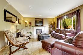 Find modern and trendy burgundy couch to make your home look chic and elegant, only on alibaba.com. Luxury Living Room Interior With Fireplace Furnished With Burgundy Leather Couches Black Ottoman And Zebra Print Chairs Stock Photo Picture And Royalty Free Image Image 30094713