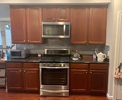 Cherry wood darkens with exposure to light, so the kitchen cabinets that you loved when you installed them, may end up being too dark for your taste after a few years. Advice On What Color To Refinish Paint My Kitchen Cabinets I Have Cherry Wood Floors Dark Granite And Light Gray Walls What Color Cabinets Would You Recommend Cabinetry