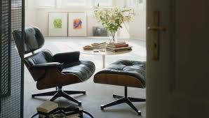 The lounge chair was designed by charles and ray eames. Vitra Vitra Lounge Chair Ottoman Walnut Black Pigmented Workbrands