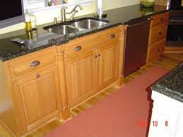 Custom Kitchen Sink By Prestige Cabinets Light Stained Wood With Black Countertops And Stai Stained Kitchen Cabinets Cabinets And Countertops Custom Cabinetry