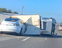 Nhtsa investigating indiana crash where tesla model 3 hit fire truck. Tesla Model 3 Owner Walks Away Uninjured After Crashing Into Overturned Truck On Highway Drive Tesla Canada