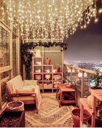 Watching The City From This Lovely Balcony Underneath The Waterfall Lights Must Be Amazing Apartment Balcony Decorating Balcony Decor Small Balcony Decor