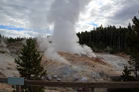 It is a totally different experience when you stroll through this thermal area because of the smell, sound, and color. Steamboat Geyser Norris Geyser Basin Ynp