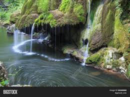 Bigăr spring is a strong spring (hence the term izbuc), fed by an underground watercourse that you can see the spring coming out from underneath the rock. Bigar Cascade Falls In Nera Beusnita Gorges National Park Romania Image Stock Photo 90026960