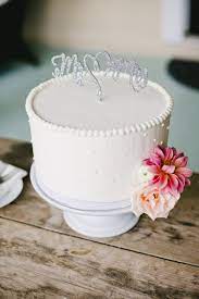 Cover with 1/2 cup of buttercream. Simple And Sweet Wedding Cake White Buttercream Single Tier Sparkly Silver Topp 25th Wedding Anniversary Cakes Wedding Anniversary Cakes Simple Wedding Cake