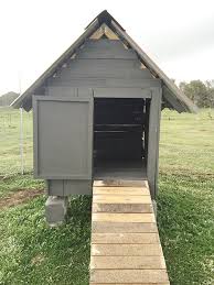 The hen chicken coop has a slanted roof, windows covered with wire for protection, a chicken pop door, and a ramp. 10 Pallet Chicken Coops Violet S Veggies