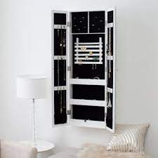 This engineered wood jewelry armoire has a handsome mahogany finish and bronze hardware for added style. Belham Living Double Door Mirrored Wall Mount Jewelry Armoire Www Hayneedle Com Wall Mounted Jewelry Armoire Mirrored Wall White Jewelry Armoire