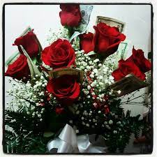 This technique works well for money origami because paper money is made with 75 percent cotton and 25 percent linen fibers in order to make it durable enough to handle being used by large numbers of people in multiple transactions. Dozen Red Roses With Money Wrapped On Each Rose Dozen Red Roses Wrapping Money Red Roses