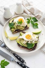 Wholegrain Toast With Avocado Egg And Soft Cheese On White Plate Healthy Breakfast Heal Healthy Food Photography Healthy Snacks Easy Smoothie Recipes Healthy