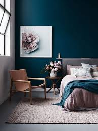 A Combo Of A Navy Statement Wall And Blush Textiles And A Blush Flower Artwork Looks Very Refined Bedroom Interior Bedroom Design House Interior