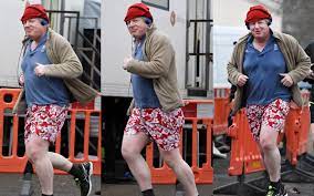 Exterior shots of foreign secretary boris johnson jogging to and from his home. Boris Johnson Cuts A Dash In Eye Catching Running Clothes