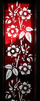 Etched or sandblasted floral pattern on glass. Aurora Glass Sandblasting Aurora Glass Sandblasting
