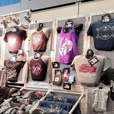 Use a variety of equipment to display merchandise like tables, floor racks, wall shelves, pegboards, cabinets, aisle shelves, mannequins and kiosks. 29 T Shirt Displays Ideas In 2021 Shirt Display Tshirt Display Retail Display