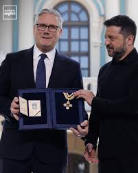 Ukrainian President Volodymyr Zelenskyy awards outgoing UK Prime Minister Keir  Starmer the “Order of Freedom,” Ukraine's highest honor for a foreign  national, in recognition of his leadership and support during Russia's  invasion.