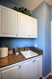 Hamilton Thermofoil Door Style With A White Finish As Featured In A Laundry Room Frameless Cabinetry White Finish Cabinetry