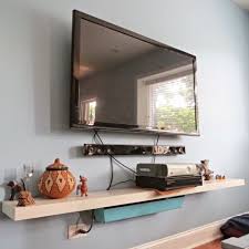 For a while we tried to hide now we have a fabulous wall to look at while laying in bed, whether the tv is on or not. How To Hide Your Television And Cable Wires An Easy Diy Flipping The Flip
