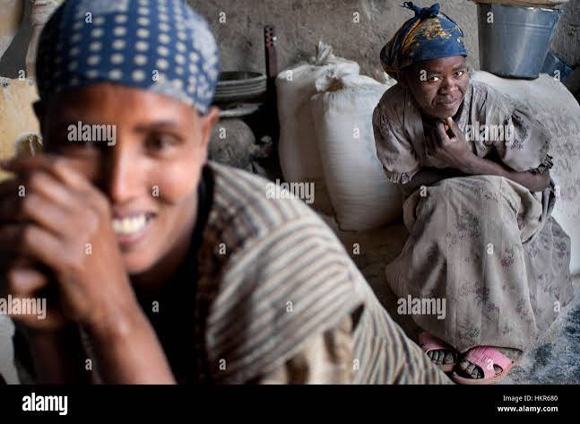 Two women grinding flour in hi-res stock photography and images - Alamy