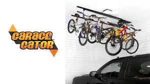 Upgrade from the pulley system and hang your bikes up high with an electric lift, like this one from garage gator that hangs up to eight bikes. Proslat Garage Storage Elevator Lifts For Kayaks Bikes Jeep Tops Proslat Us