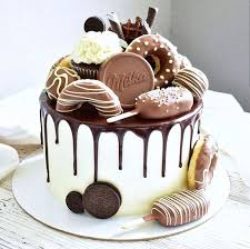 This Overloaded Drip Cake Would Be Perfect For Any Chocoholic Complete With Chocolate Doughnuts Milka Crazy Cakes Birthday Cake Chocolate Chocolate Drip Cake