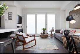 Rich gray walls are paired with neutral furnishings and a gray graphic area rug. A Bryk At A Time Watch Online Full Episodes Videos Hgtv Ca Home Decor House Design
