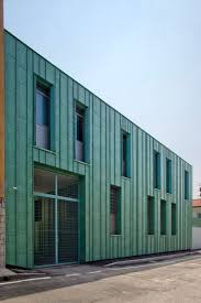 The Green Finish Applied To The Metal Cladding Of This Police Station Extension In Italy Resembles Oxidised Colour Architecture Metal Cladding Cladding Design