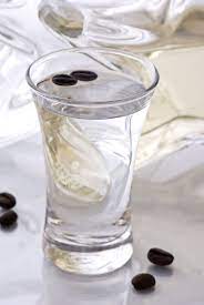 Often referred to a sambuca fly, a shot of the alcoholic spirit may be served with a roasted coffee bean in the glass, which is chewed when drinking. Sambuca With Coffee Beans Getranke