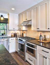 A Dated 70 S House Gets A Make Over For A Young Bachelor Kitchen Remodel Kitchen Remodel Layout Kitchen Remodel Small White Kitchen Remodeling