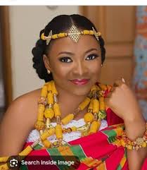 Black beads with white design and red dirt beads from Dassa, Benin