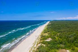 The curonian spit is a narrow sand dune peninsula, preserved from erosion through human efforts since the 19th century. Curonian Spit Stock Photos Offset
