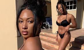 While she showed off her natural hair proudly, megan also hinted that she misses her wigs in the post. Megan Thee Stallion Shows Off Her Bombshell Bikini Body In A Barely There Black Two Piece Daily Mail Online