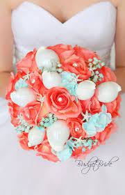 Perfect for bride or bridesmaids! Coral Reef Davids Bridal Wedding Flowers For Bride In Coral Reef And Aqua With Seashells And S Bridal Wedding Flowers Beach Theme Wedding Coral Bouquet Wedding