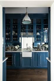 Blue Lacquered Bar Cabinets Are Fitted With A Glass Front Wine Fridge And Hold A Mini Arpon Sink Paired With A In 2020 Kitchen Design Kitchen Refinishing Butler Pantry