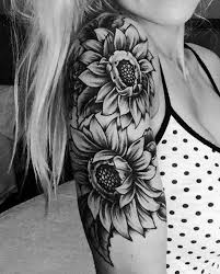 A sunflower tattoo looks great on your arm, and these types of tattoos are becoming more popular. 20 Of The Most Boujee Sunflower Tattoo Ideas Cool Shoulder Tattoos Shoulder Tattoos For Women Sunflower Tattoo Shoulder