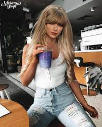 Taylor poses for a photoshoot on a beach. Pictures Of Taylor Swift In Tight Blue Jeans Pictures Of Taylor Swift In Tight Blue Jeans Taylor Swift Is Currently One Of The Most Popular International Singers And