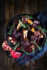 While shanks are browning, combine wine, chicken stock, tomatoes, tomato paste,honey, and orange juice and zest. Moroccan Braised Lamb Shanks With Pomegranate Feasting At Home