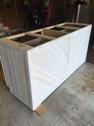 Building kitchen island bar breakfast islnd cbinets ing diy base. Kitchen Island Made From 2 Stock Base Cabinets Wrapped With Tongue And Grooved Cedar Planks Kitchen Island Base Diy Kitchen Island Kitchen Cabinet Layout