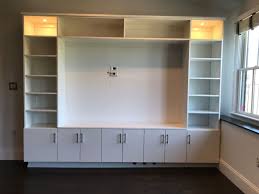 White gloss is always a good furniture finish. Custom Entertainment Center Installation Ç€ Boston Closet Company