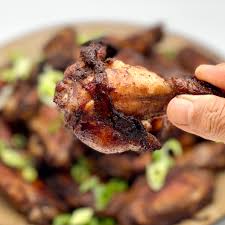 Grilled chicken wings using a charcoal vortex, seasoned with a cajun seasoning and tossed in a sweet & spicy voodoo sauce. Voodoo Chicken Wings Asian Plus Caribbean Jerk Spices Julietkitchen Com