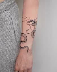 A dragon tattoo is always ideal because you are showcasing the best art as shown above. Tatti 040 Tattoos On Instagram A Delicate Dragon That Wraps Around The Arm Swipe To See It In Action Around Arm Tattoo Wrap Around Tattoo Simple Arm Tattoos
