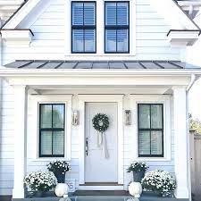The light grey house exterior with white trim here shows many impressions. This Lovely Country Farmhouse Design Features Black Trim Design Sixty Five Charming Inspir In 2021 White Siding White Exterior Paint Exterior Paint Colors For House