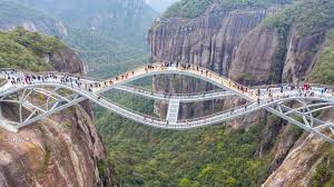 But in recent years, a new kind of attraction has been offering competition: China Opens 140m High Bending Glass Bridge