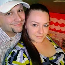 Is the guy in the wheelchair hanging out in the middle of the street?