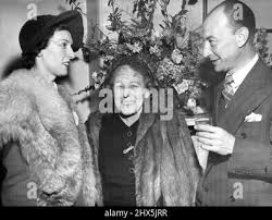 Associate conductor of the Sydney Symphony Orchestra Joseph Post and Mrs.  Post, in England, where Mr. Post is