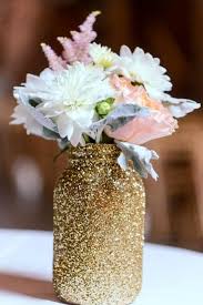 The ribbon creates the theme and accents the mason jars, candles and wreaths quickly and creatively! 20 Mason Jar Wedding Centerpiece Ideas Craftsy Hacks