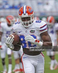 Raphael Andrades of the Florida Gators runs with the ball prior to... News  Photo