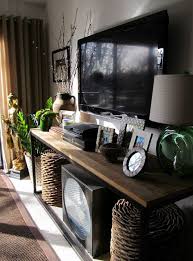 My Tv Console With Woven Stools Below For Extra Seating Home Living Room Tv Decor Tv Stand Decor