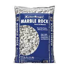These chips help to retain moisture, are easy to spread for convenience and help to contain erosion. Kolor Scape 0 4 Cu Ft Gray Marble Chips Lowes Com Landscaping With Rocks Landscaping Rock Marble Rock