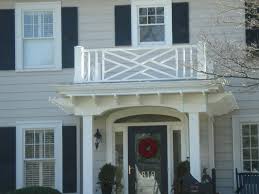 Contemporary front balcony design with glass and chrome. Modern House Front Balcony Design Furnished