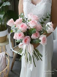 Kristine's bouquet of light pink roses perfectly matched the wedding's soft and romantic theme. Minimalist Pink Rose Bridal Flower Bouquet Scentales Florist