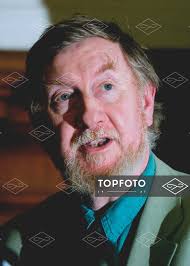 Forensic scientist Professor Bill McCormack of Goldsmiths College, London,  checks a slide copy of an original